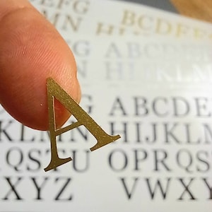 2 sets Tiny Alphabet-vinylstickers/stickers. 0,5''-1,0'' vinylletters.