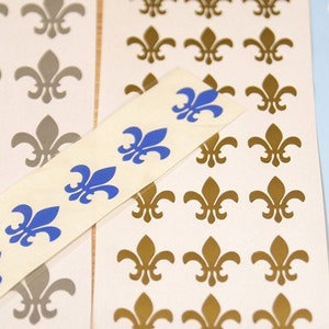 CONJUNTO-12 decalques/adesivos de vinil Flor de Lis. Decalques faça você mesmo.