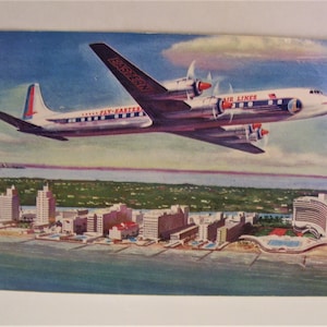 1964 Aviation Carte postale Avion Golden Falcon DC-7B Eastern Air Lines RPPC