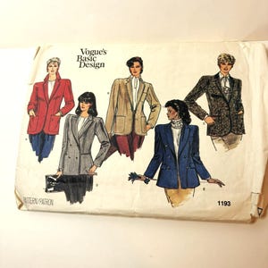 May include: A Vogue Basic Design sewing pattern envelope, number 1193, featuring illustrations of five different blazer styles. The designs include a red blazer, a grey pinstripe blazer, a tan blazer, a blue blazer, and a dark patterned blazer.