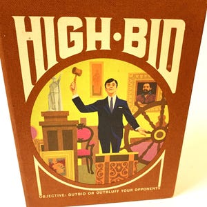 May include: A vintage board game box with a yellow background and the text "HIGH-BID" in white. The box features an illustration of a man in a suit holding a gavel, standing in front of a variety of items, including a statue, a chair, a painting, and a ship's wheel. The text "OBJECTIVE: OUTBID OR OUTBLUFF YOUR OPPONENTS" is printed at the bottom of the box.