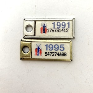 2 Vintage War Amps Key Ring Tags 1991 1995 1 1/2" x 1/2" Canadian