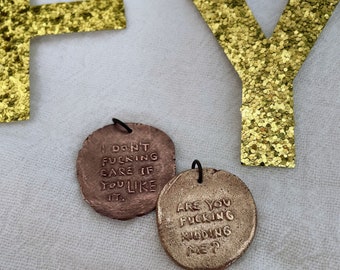 Are you kidding, I don't fucking care: a pair of fucking handmade charms