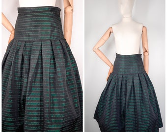 May include: A black and green striped skirt with a high waist and a full, gathered skirt. The skirt is made of a shiny fabric and has a vintage style.