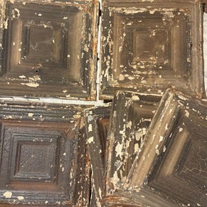 May include: A set of three ceramic mugs with a speckled, matte finish. The mugs are in shades of cream, light gray, and dark gray. Each mug has a simple, minimalist design and a rounded handle.