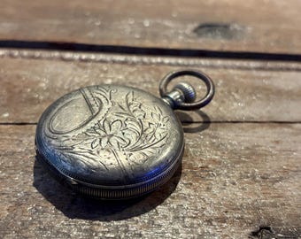 Raro reloj de bolsillo Seth Thomas de la década de 1890 en estuche de plata "Warranted Coin"