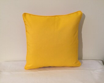 Bright yellow Sunbrella Sunflower pillow cover