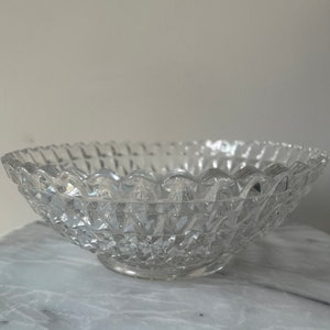 Vintage clear, cut glass serving bowl with scalloped edging.