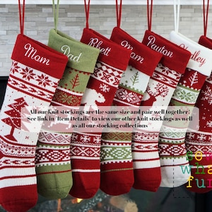 May include: A set of seven red, green, and white knit Christmas stockings with personalized names. The stockings have a Scandinavian-inspired pattern with snowflakes, trees, and reindeer. The text "All our knit stockings are the same size and pair well together! See link in "Item Details" to view our other knit stockings as well as all our stocking collections" is printed below the stockings.