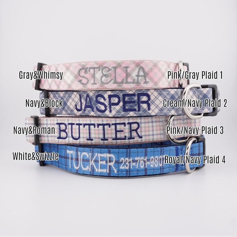 May include: Four stacked dog collars featuring plaid patterns in pink/gray, cream/navy, pink/navy, and royal/navy. Each collar is embroidered with names: STELLA, JASPER, BUTTER, and TUCKER with a phone number. Includes black buckles and metal D-rings.