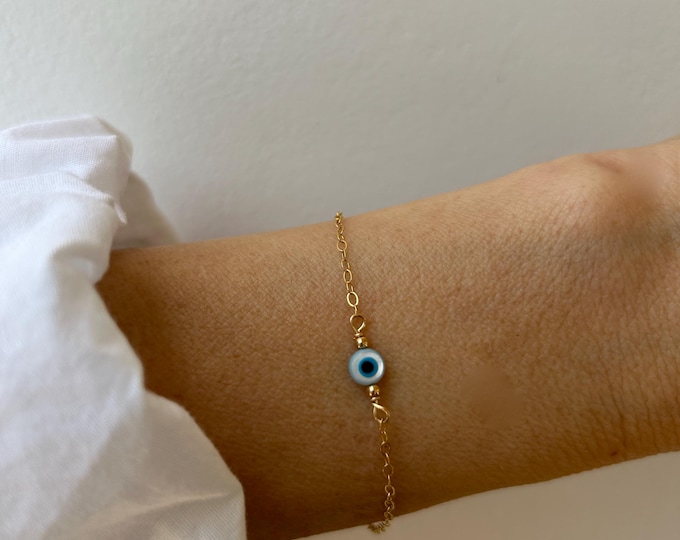 14k Gold filled evil eye bracelet. Mother of pearl evil eye sterling silver chain bracelet.