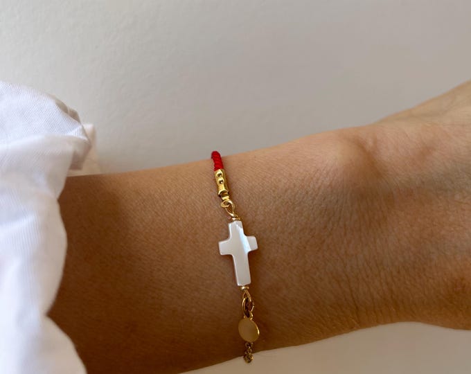 Red string cross bracelet.  Mother of pearl sideways cross. Gold, silver stainless steel