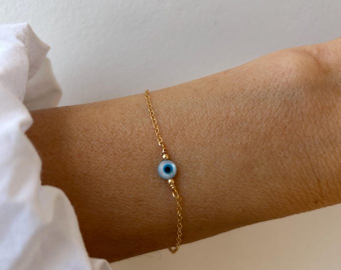 14k Gold filled evil eye bracelet. Mother of pearl evil eye sterling silver chain bracelet.