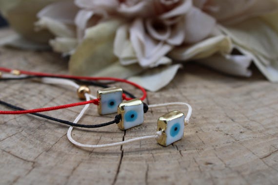 Evil eye cord bracelet. Unisex adjustable evil eye string bracelet. Mens evil eye cord bracelet. Enamel brass evil eye charm bracelet.