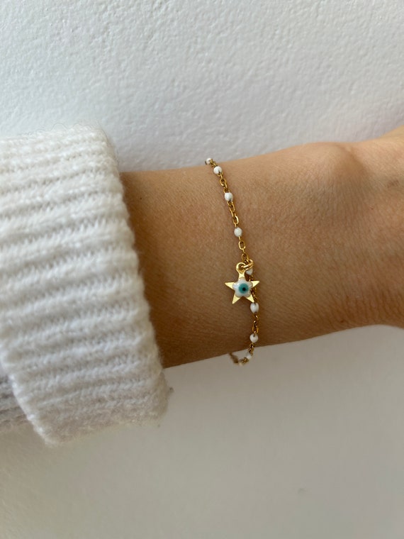 Evil eye bracelet. Little star evil eye bracelet. White rosary chain bracelet with evil eye charm.