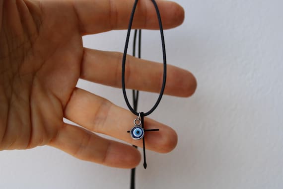 Mens stainless steel cross and evil eye cord necklace. Black stainless steel cross pendant necklace.  Cord necklace with cross and evil eye.