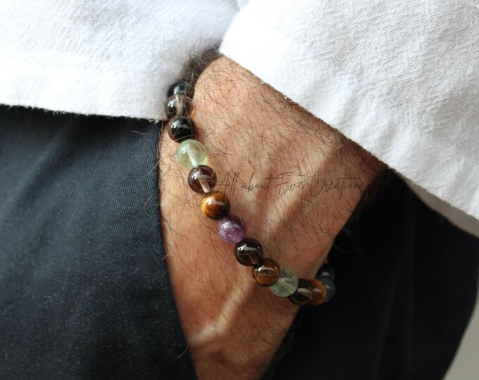 Abundance and protection beaded bracelet.(8mm beads )Tiger's eye, rainbow fluorit, smoky quartz . Stretch cord