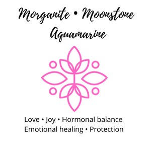 May include: Pink graphic of a flower with six petals and six circles around it. Text reads: Morganite &bull; Moonstone Aquamarine. Love &bull; Joy &bull; Hormonal balance Emotional healing &bull; Protection
