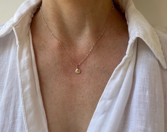 Delicate 14k gold filled shell charm necklace. Beach theme. Whisper chain.