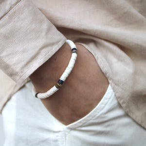 Surfer bracelet. White heishi puka shell bracelet. White litub shell beaded bracelet. Stretch bracelet. Waterproof bracelet.
