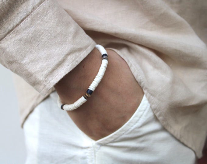 Surfer bracelet. White heishi puka shell bracelet. White litub shell beaded bracelet. Stretch bracelet. Waterproof bracelet.