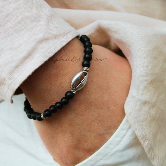 Mens beaded shell bracelet. Mens cowrie shell bracelet. Turquoise, howlite, black stone stacking bracelet. Gift for him.