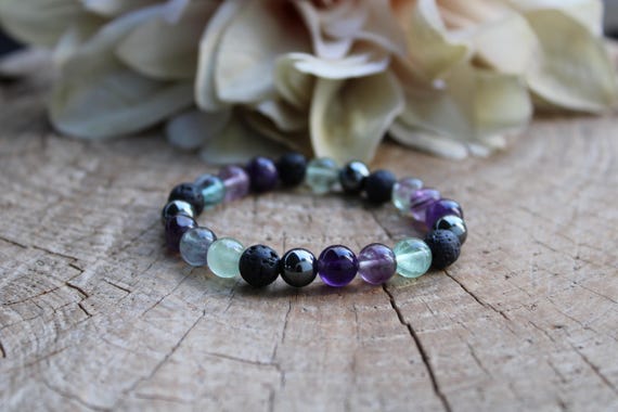 Amethyst, rainbow fluorite, lava rock and hematite bracelet. Stretch bracelet. Energy bracelet . Abundance, protection and grounding.(8mm)