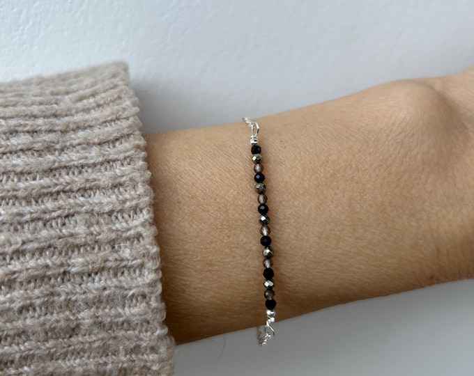 Gemstone bracelet. Protection, grounding, and personal empowerment. Black tourmaline, pyrite, smoky quartz . Gold, silver chain.