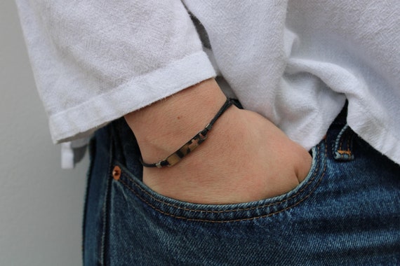 Mens sideways cross cord bracelet.  Adjustable cord bracelet with cross. Waterproof stainless steel.  Religious gift.