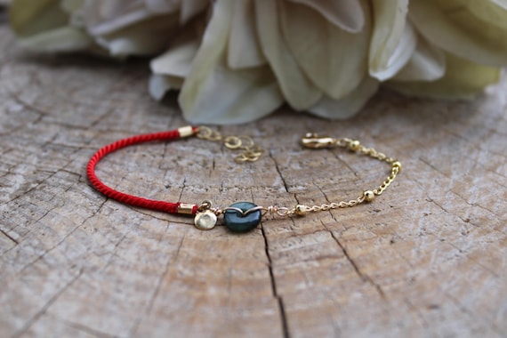 Jade donut red string bracelet. Bracelet for good luck, abundance and protection. Gold filled bracelet.