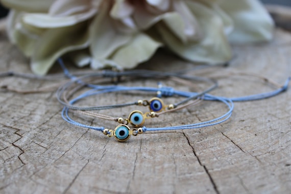 Evil eye cord bracelet. String bracelet. Protection bracelet. Adjustable bracelet.
