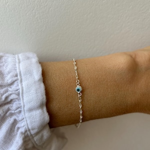 Sterling silver evil eye and cross bracelet.  Greek mati bracelet with tiny cross. Sterling silver evil eye chain bracelet.