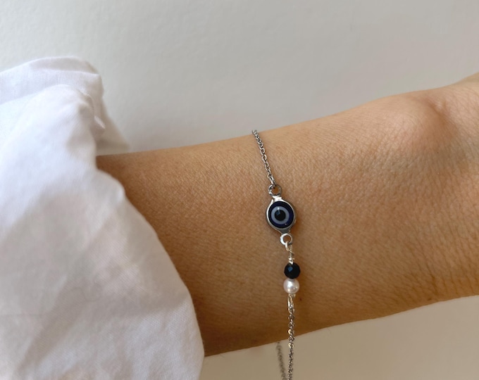 Gold Filled Evil Eye Bracelet with Freshwater Pearl and black tourmaline. Stainless steel