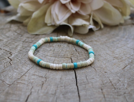 Mens coconut bracelet. Surfer style wood bead bracelet. White and blue beaded mens bracelet. Turquoise bracelet. Stretch bracelet.