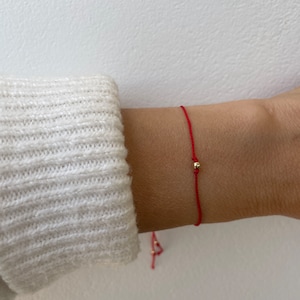 Red string bracelet with solid gold bead silk bracelet. 9k Solid gold bead red string bracelet . Silk cord bracelet (11 colours available)