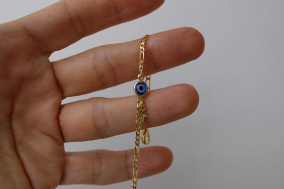 Evil eye and cross bracelet . Gold filled Figaro bracelet with evil eye and tiny cross. Greek mati bracelet.  Blue evil eye bracelet.