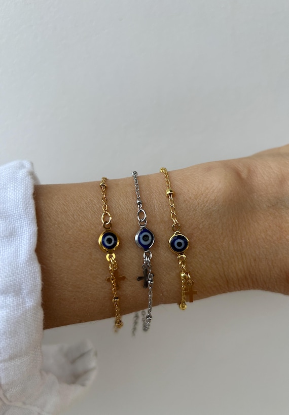 Evil eye and cross bracelet  .Blue evil eye bracelet. Gold filled evil eye bracelet with tiny cross. Gold, silver stainless steel.