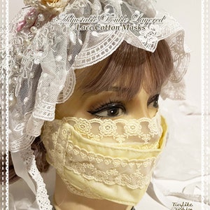 May include: A yellow cotton face mask with two layers of delicate white lace. The mask is adjustable and has a white ribbon tie. The text "Ajustable Double Layered Lace Cotton Masks" is written above the mask. The text "Twylite Fashion" is written below the mask. The text "www.twylitefashion.com Facebook:Twylite Fashion www.etsy.com/shop/TwyliteFashion" is written below the text "Twylite Fashion".