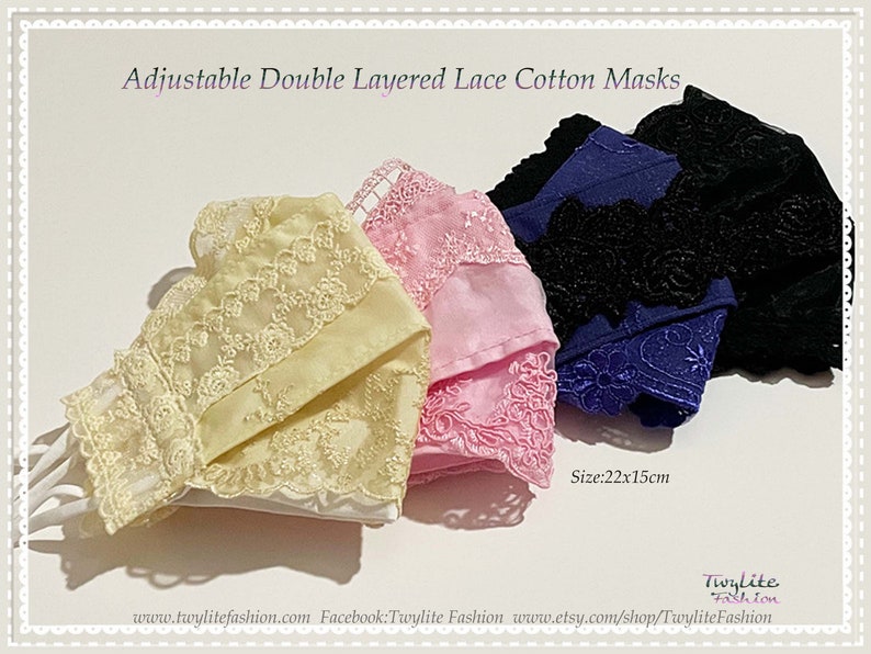 May include: Four double-layered cotton face masks with adjustable ear loops. The masks are made of white cotton with delicate lace trim in yellow, pink, blue, and black.