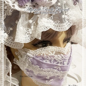 May include: A double-layered lavender lace face mask with white lace trim. The mask is adjustable and measures 14 inches by 22 inches. "Adjustable Double Layered Lace Cotton Masks" and "Size: 14x22cm" are printed on the mask.