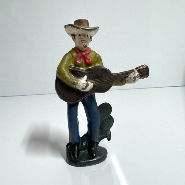 Rare 4.6” Vintage Western Cast Iron Bottle Opener Cowboy Playing Guitar Antique Bar Paperweight Collectible Made in USA