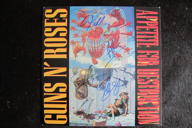 May include: A Guns N' Roses album cover with the title "Appetite for Destruction" in red and yellow text. The cover features a skeletal figure with a flaming head, a woman in a white dress, and a red and white monster in the sky.