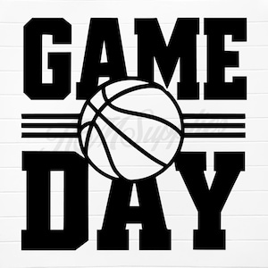May include: Black and white graphic with the words "GAME DAY" in bold, block letters. A basketball is centered between the words, with two horizontal lines above it. The design is on a white background.