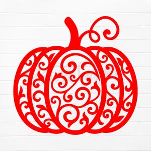 May include: A red pumpkin silhouette with intricate, swirling cut-out designs. The pumpkin features a stem and a curly vine, perfect for fall decor. The design is set against a white, wood-grain background.