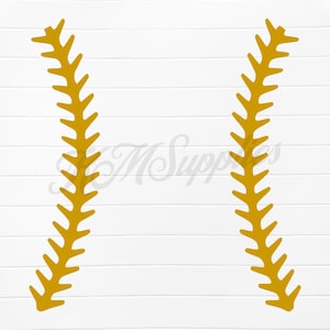 May include: Two golden-yellow, stylized baseball stitches on a white background. The stitches are curved and feature a series of pointed projections along their length. The background has a subtle wood grain texture.