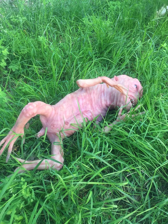 crawling alien doll