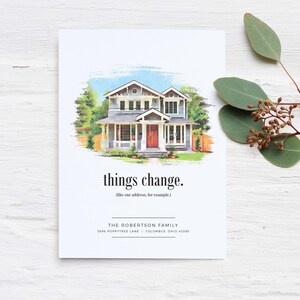 May include: A watercolor illustration of a two-story house with a red door. The text "things change. (like our address, for example)" is below the house. The text "THE ROBERTSON FAMILY 1896 POPPYTREE LANE | COLUMBUS, OHIO 43205" is at the bottom of the card.