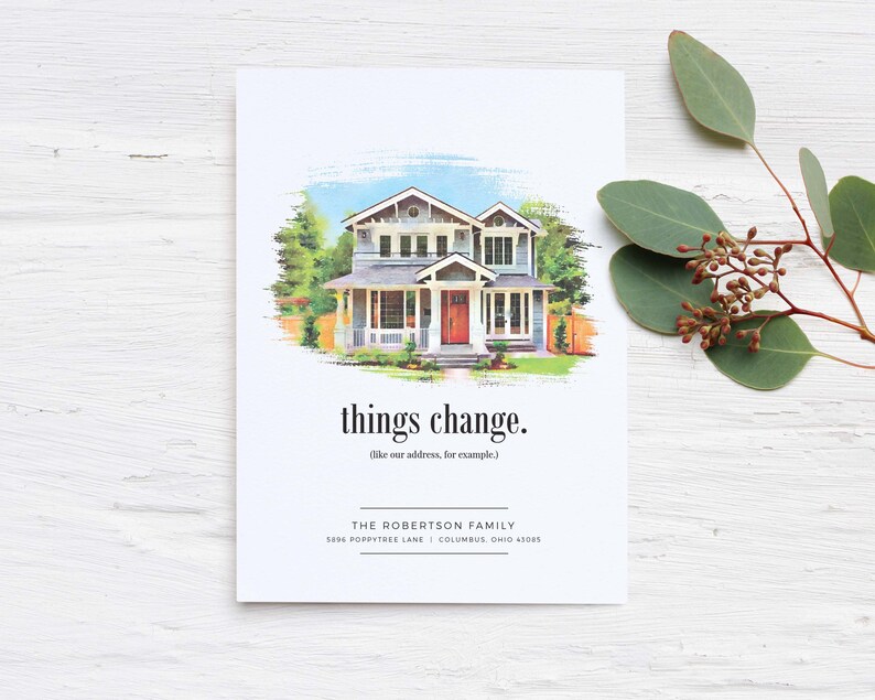 May include: A watercolor illustration of a two-story house with a red door. The text "things change. (like our address, for example)" is below the house. The text "THE ROBERTSON FAMILY 1896 POPPYTREE LANE | COLUMBUS, OHIO 43205" is at the bottom of the card.