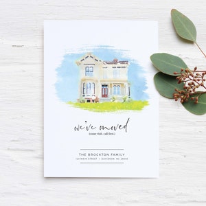 May include: A watercolor illustration of a white house with a green lawn. The text "we've moved (come visit, call first)" is below the house. The text "THE BROCKTON FAMILY 123 MAIN STREET | DAVIDSON, NC 28016" is below the text.
