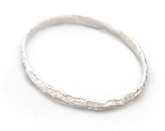 REEF: Thick Oval Bangle Bracelet in Solid Silver with High Polish Finish and Coral Reef Texture